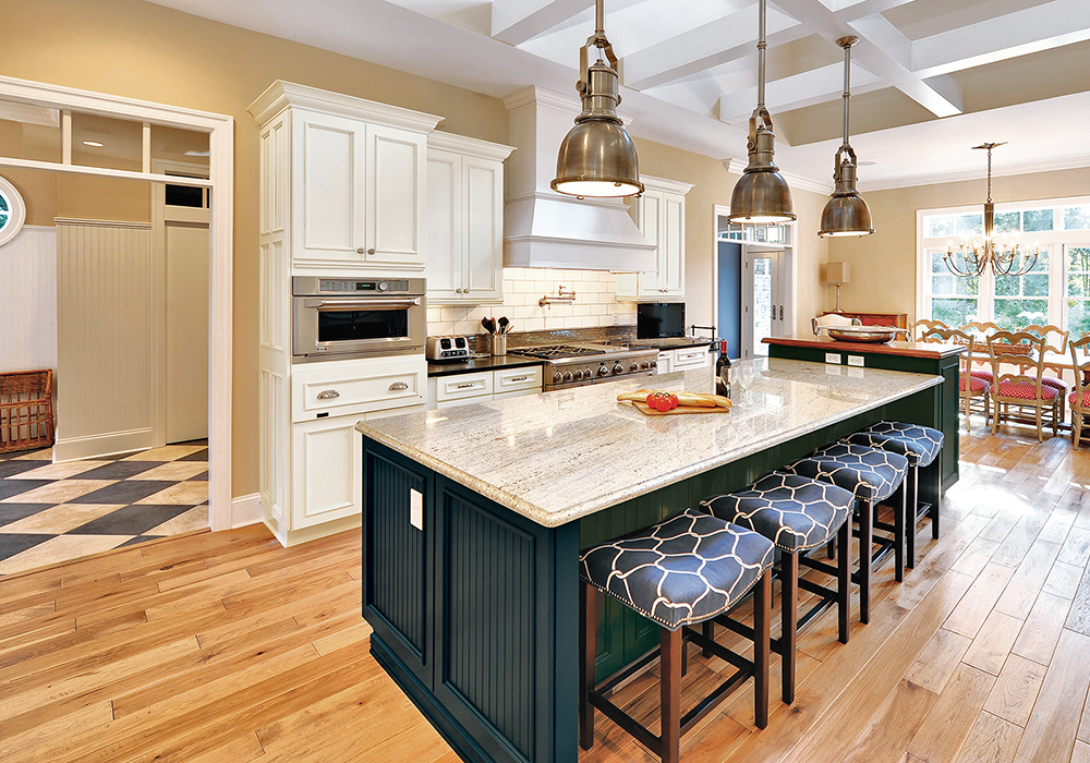 Kitchen with white cabinets and blue island